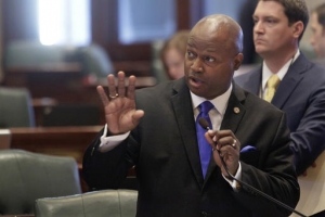 FILE - In this May 25, 2016 file photo, Illinois Rep. Emanuel Chris Welch, D-Westchester, speaks to lawmakers at the Capitol in Springfield, Ill. States have begun passing laws dealing with how online accounts can be accessed after death. Until now, Google, Facebook and other companies have said a federal privacy law bars them from releasing information unless they have permission from the account owner even if that person is dead. Welch, a suburban Chicago lawmaker, sponsored Illinois' measure on the topic. (AP Photo/Seth Perlman, File)